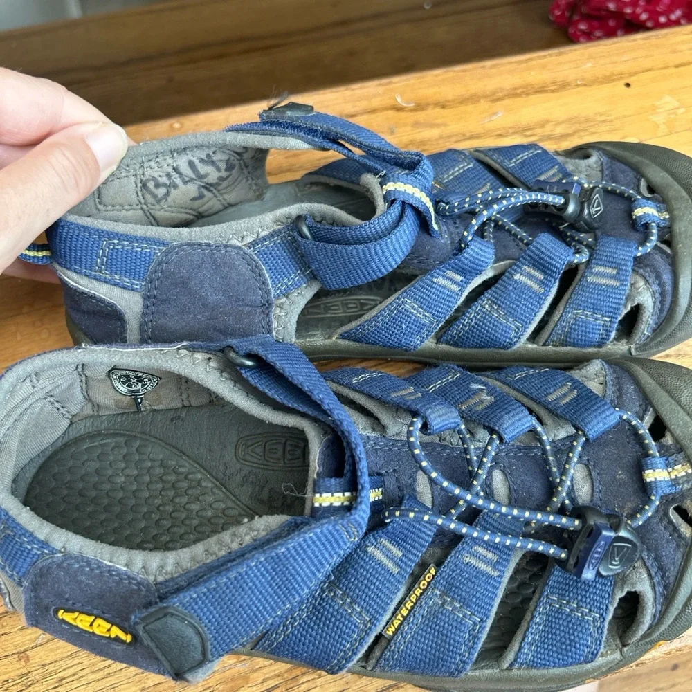 KEEN Kids' Newport H2 Sandals in a blue colorway hiking beach camp outdoors